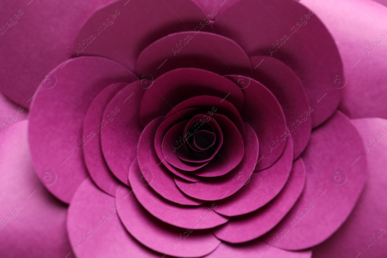 Photo of Beautiful pink flower made of paper as background, top view