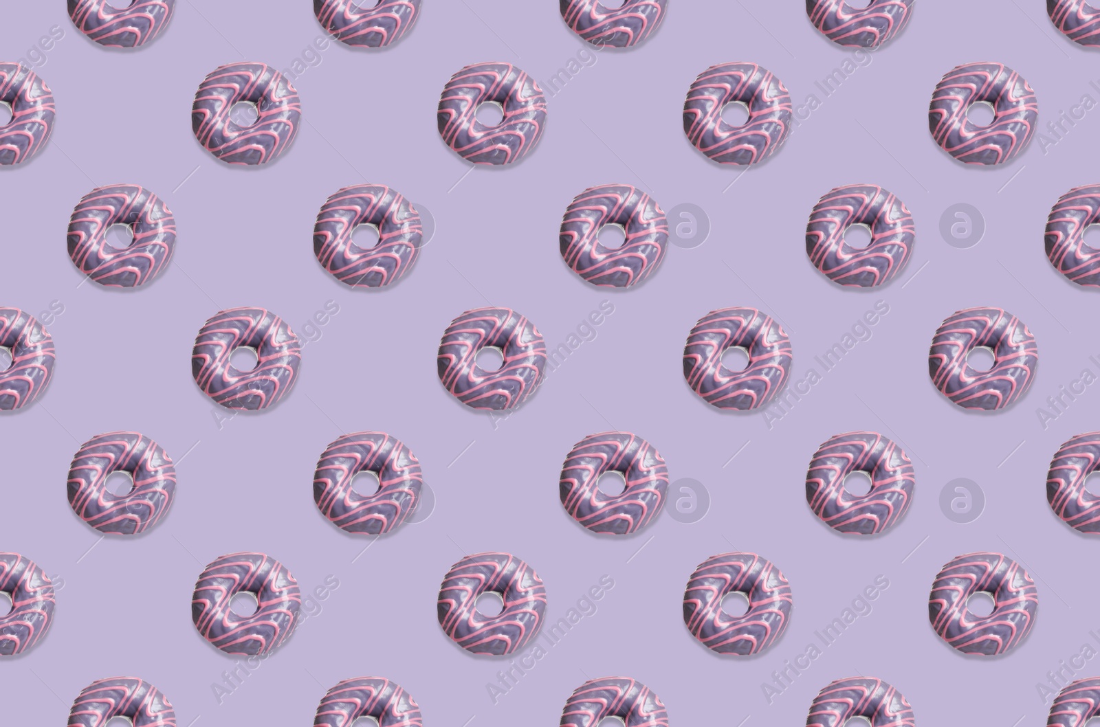 Image of Creative pattern design of glazed donuts on pale purple background