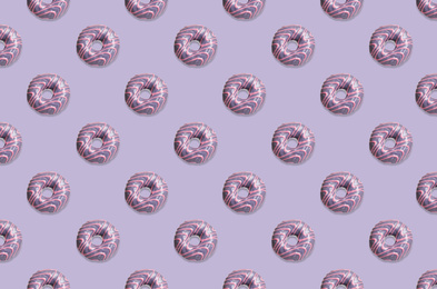 Image of Creative pattern design of glazed donuts on pale purple background