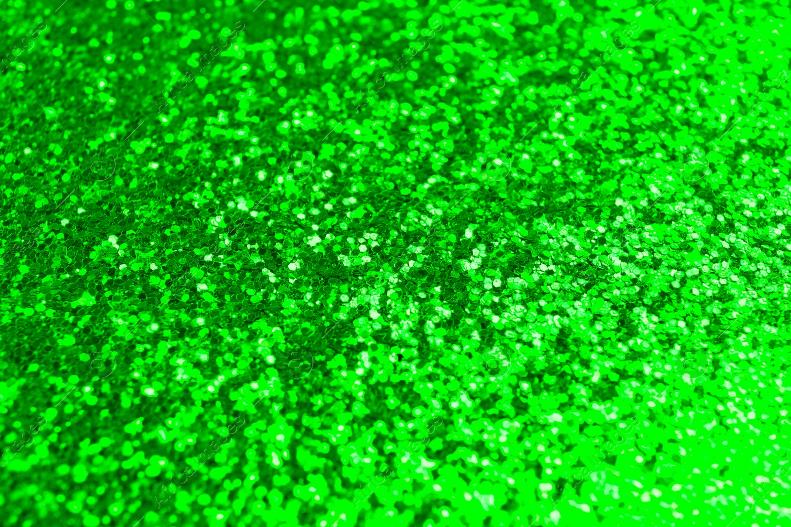 Image of St. Patrick day. Shiny green glitter, closeup