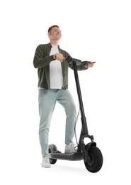 Happy man with modern electric kick scooter on white background, low angle view