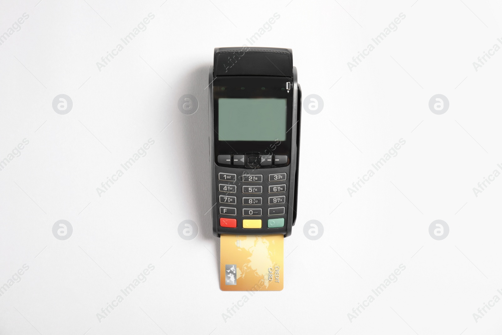 Photo of Modern payment terminal with credit card on white background, top view