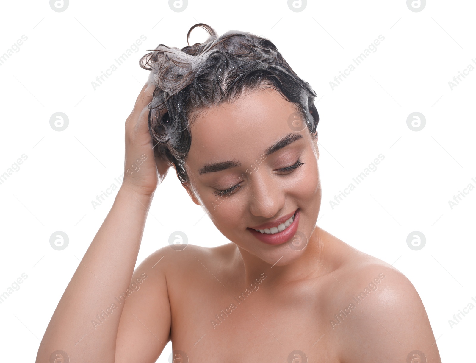 Photo of Beautiful happy woman washing hair on white background