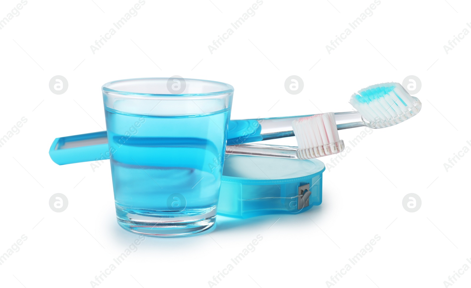 Photo of Mouthwash and other items for teeth care on white background