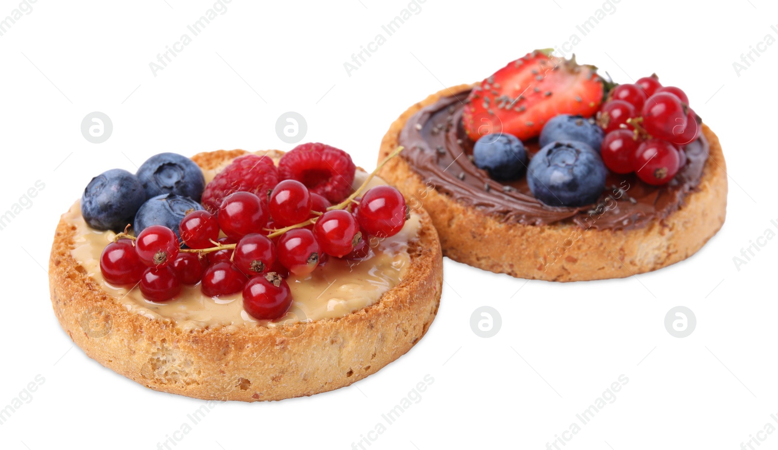 Photo of Tasty organic rusks with different toppings isolated on white