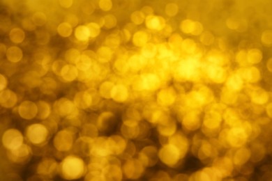 Photo of Blurred view of golden lights as background. Bokeh effect