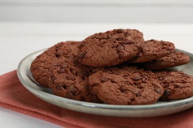 Delicious chocolate chip cookies on white table, closeup