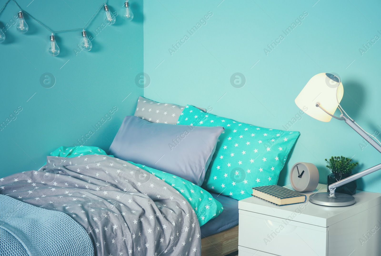 Photo of Comfortable bed in modern children room