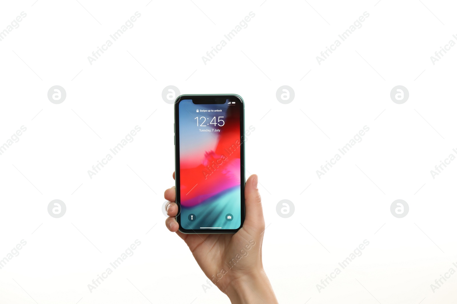 Photo of MYKOLAIV, UKRAINE - JUNE 9, 2020: Woman holding  iPhone X with locked screen on white background, closeup