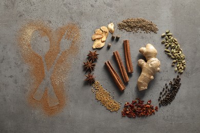 Different spices and silhouettes of cutlery on grey textured table, flat lay