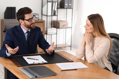Photo of Woman having meeting with lawyer in office