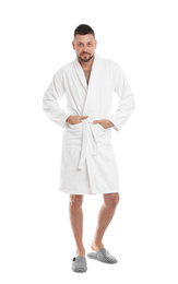 Photo of Handsome man wearing bathrobe on white background