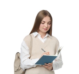 Photo of Teenage student with backpack writing in notebook on white background