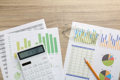 Photo of Accounting documents, calculator, pencil and glasses on wooden table, flat lay