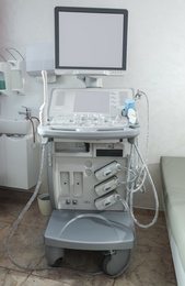 Modern ultrasound machine in clinic, space for text