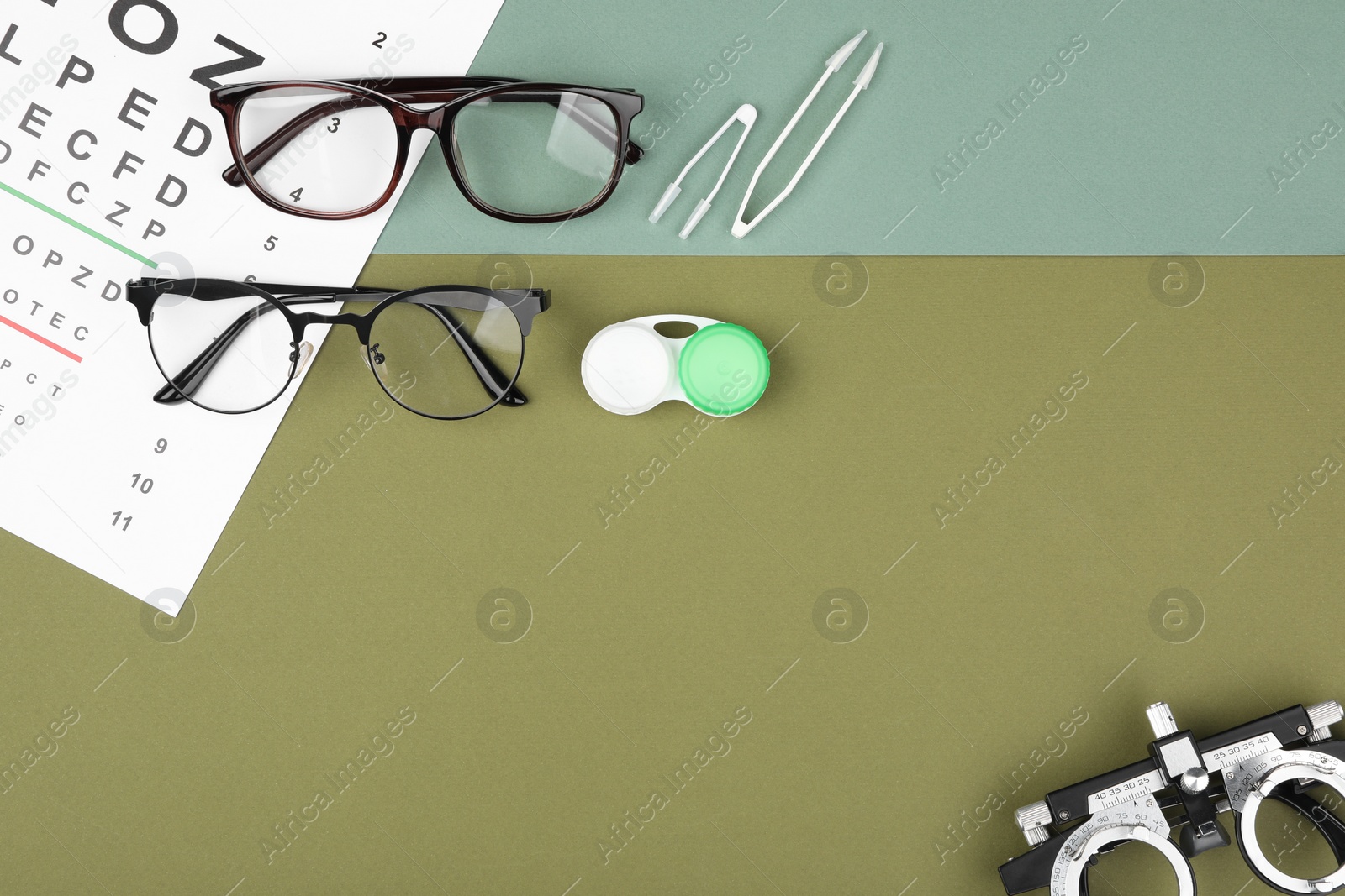 Photo of Flat lay composition with vision test chart and glasses on color background, space for text