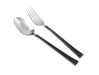 Photo of New fork and spoon with black handles on white background
