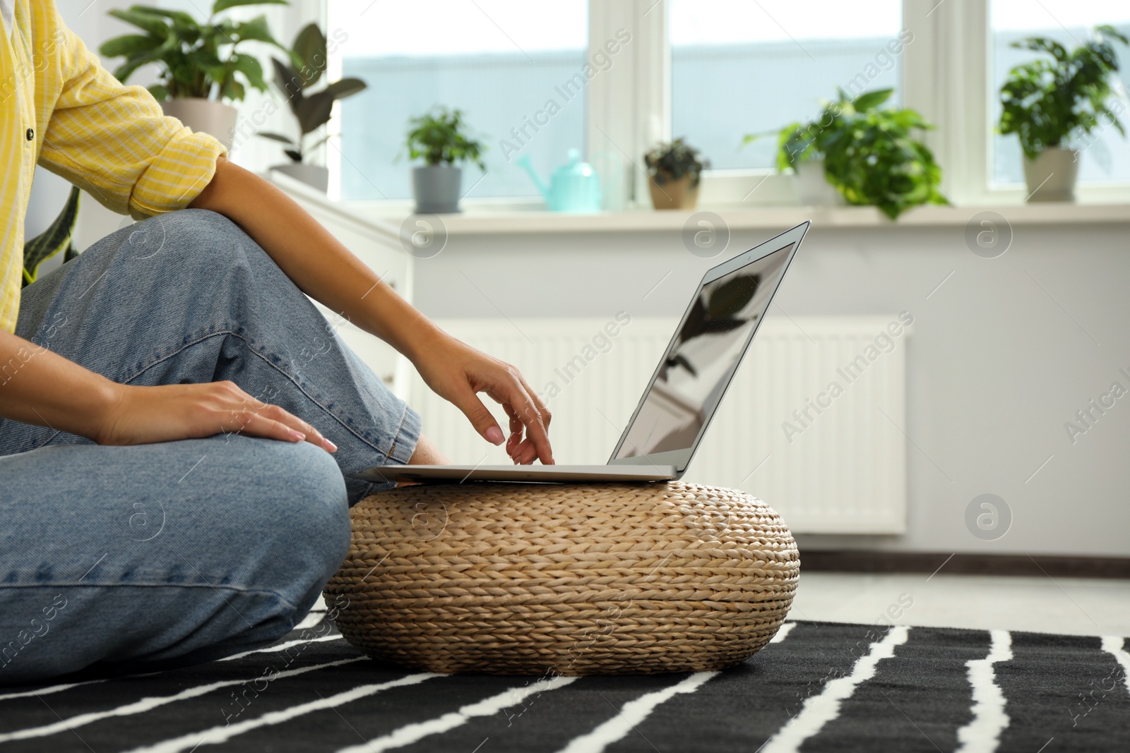 Photo of Woman working with laptop at home, closeup view