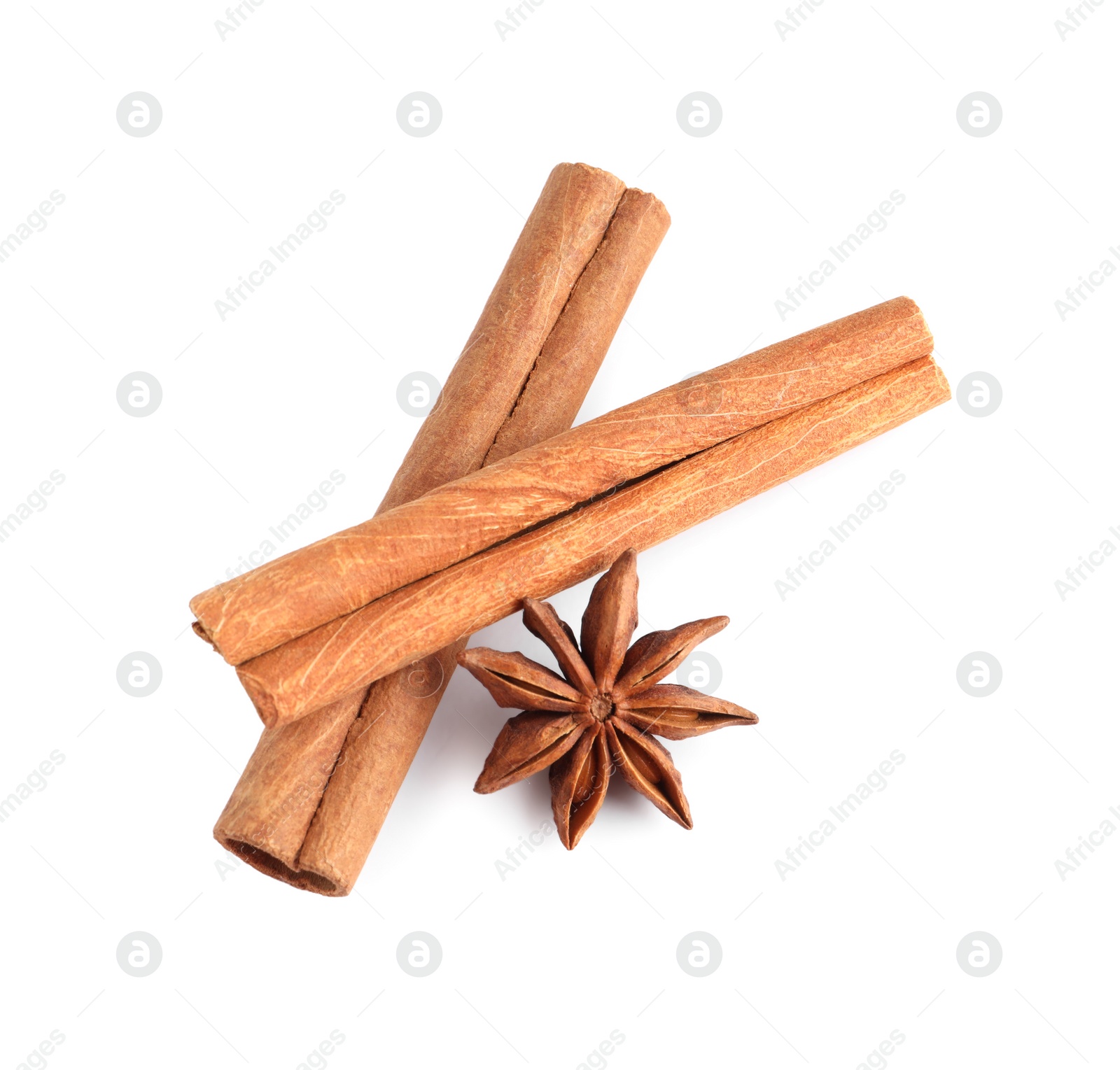 Photo of Cinnamon sticks and anise star isolated on white, top view