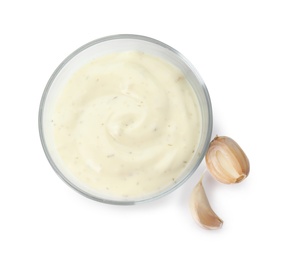 Photo of Bowl of homemade sauce and garlic cloves isolated on white, top view