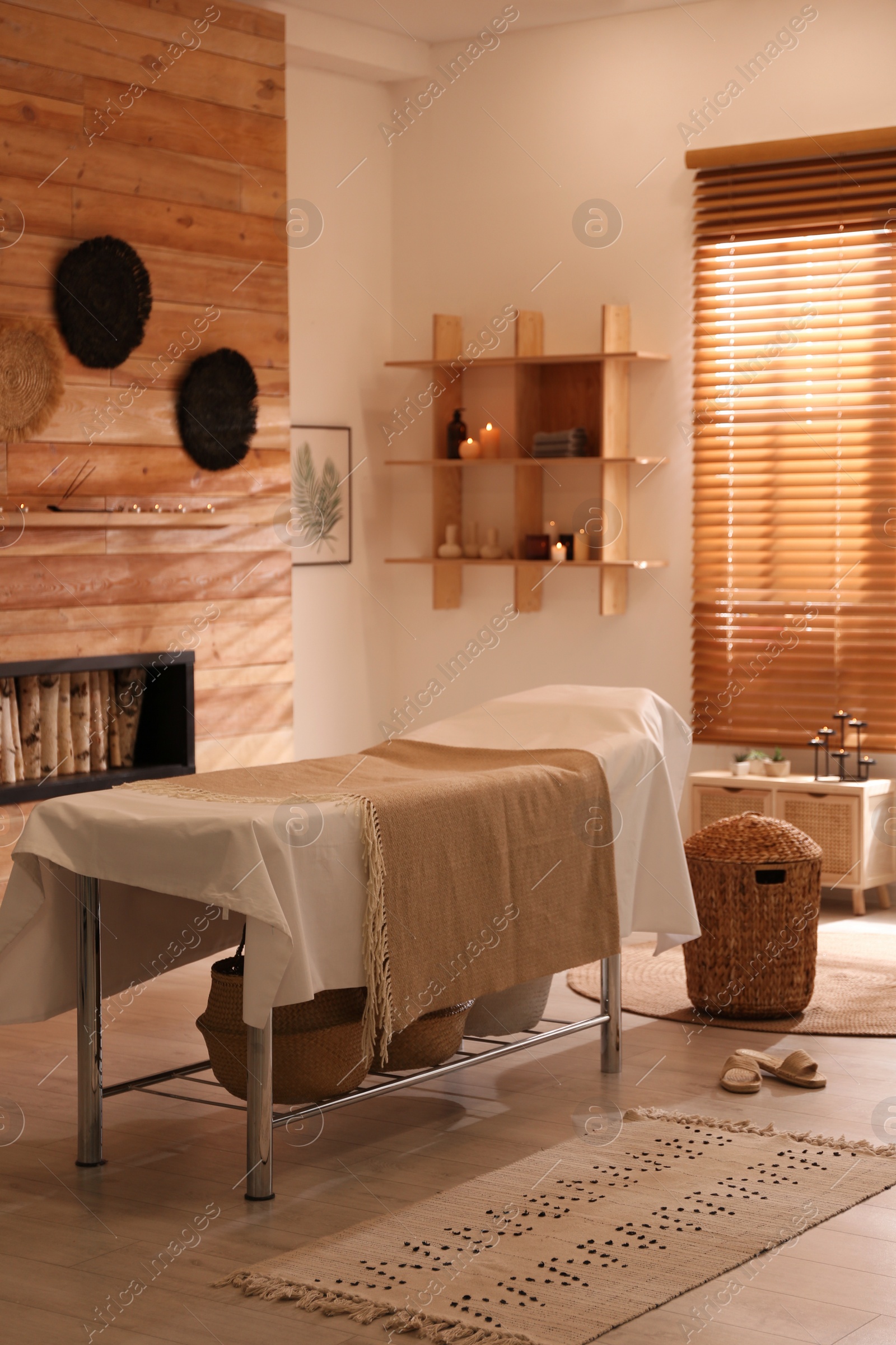 Photo of Stylish massage room interior in spa salon