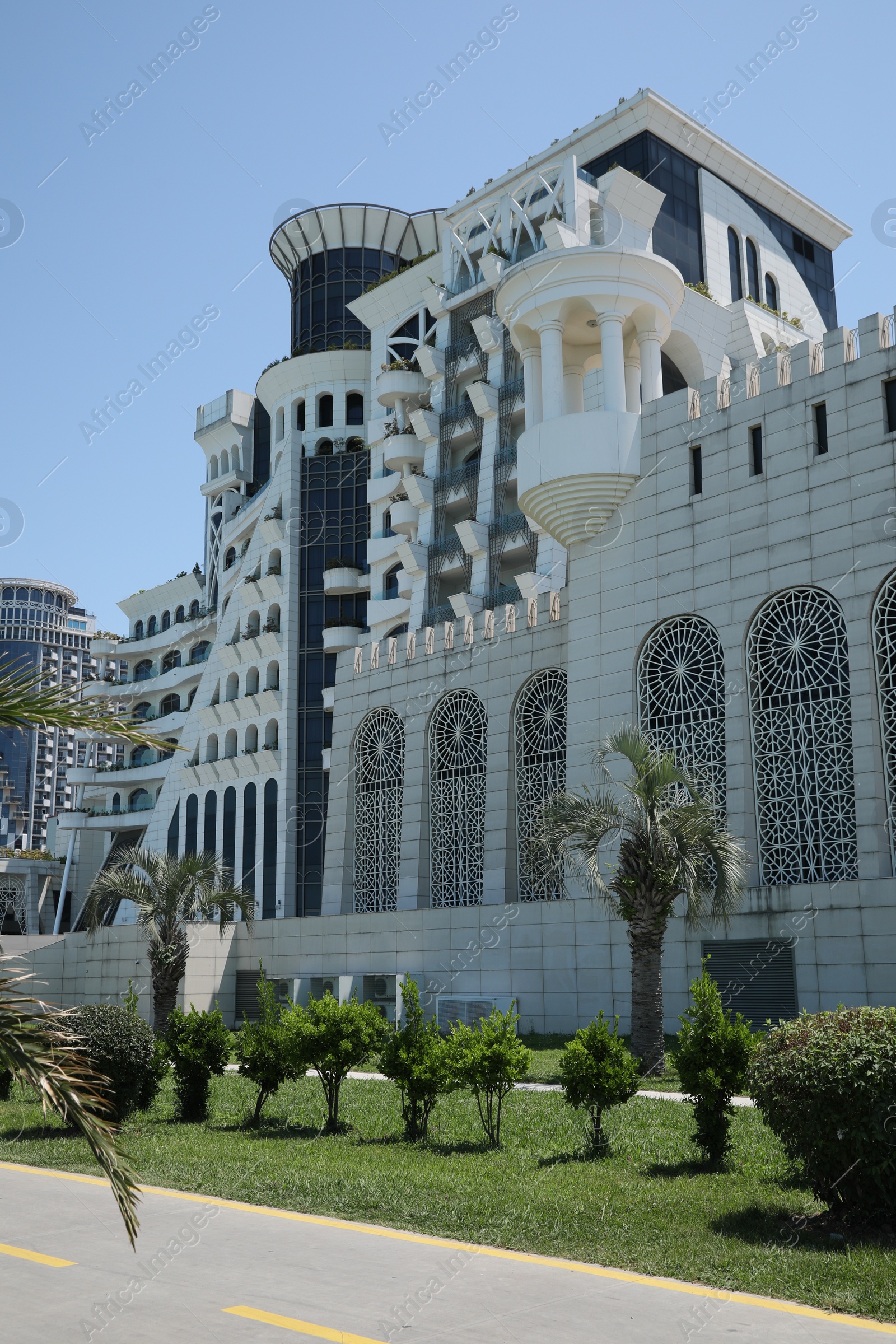 Photo of BATUMI, GEORGIA - JUNE 10, 2022: Beautiful view of Grand Gloria Hotel on sunny day