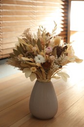 Bouquet of dry flowers on table indoors