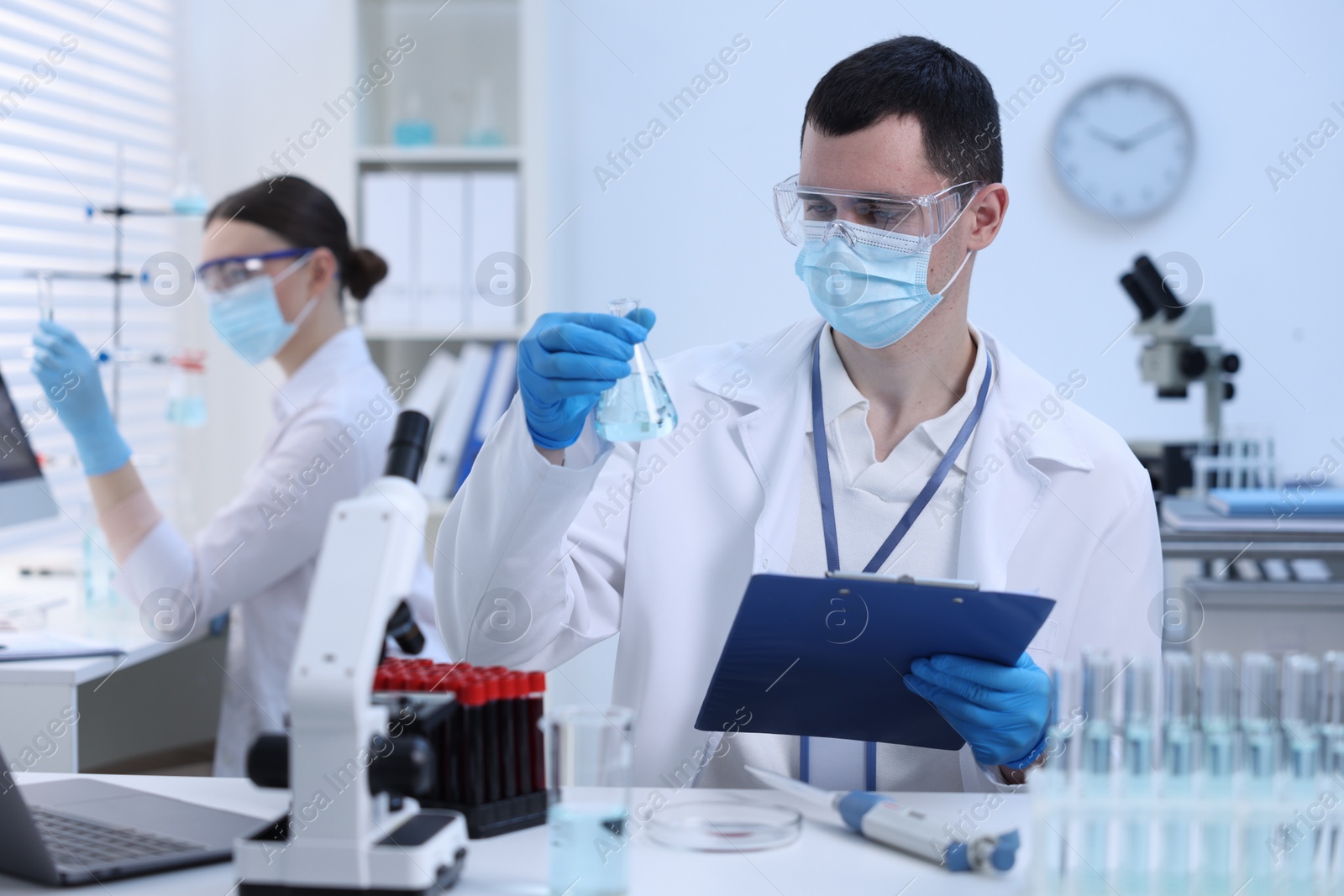 Photo of Scientists working with samples in laboratory. Medical research