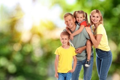 Image of Happy family with children outdoors on sunny day, space for text