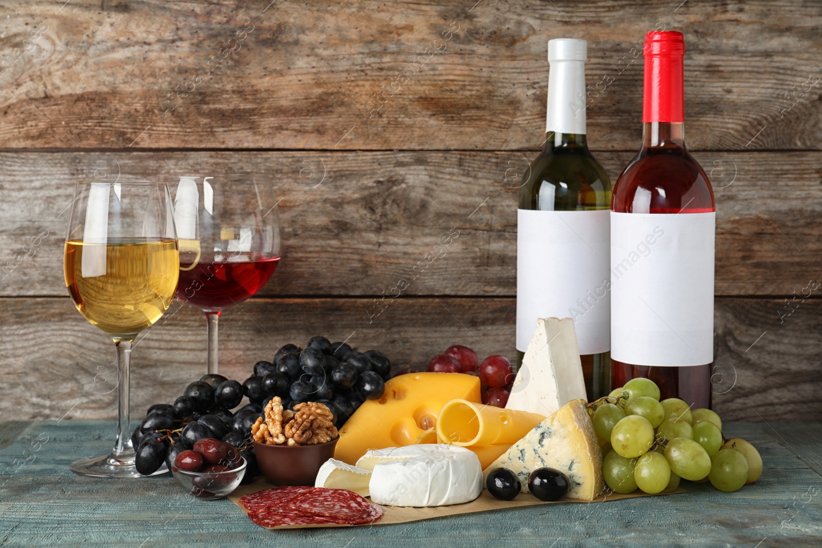 Photo of Composition with wine and snacks on table. Space for design