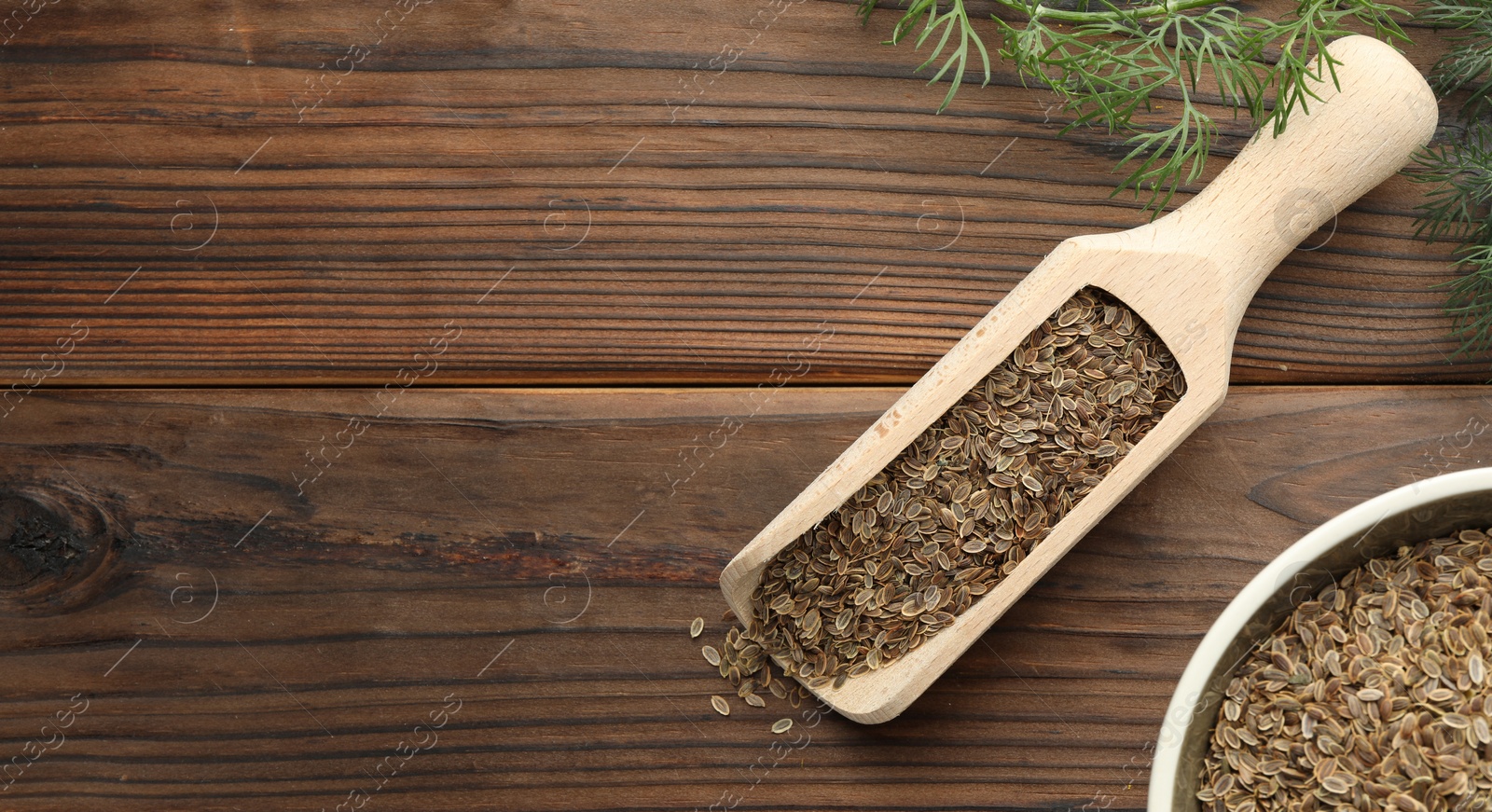 Image of Dill seeds in scoop and bowl on wooden table, flat lay. Banner design with space for text