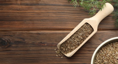 Image of Dill seeds in scoop and bowl on wooden table, flat lay. Banner design with space for text