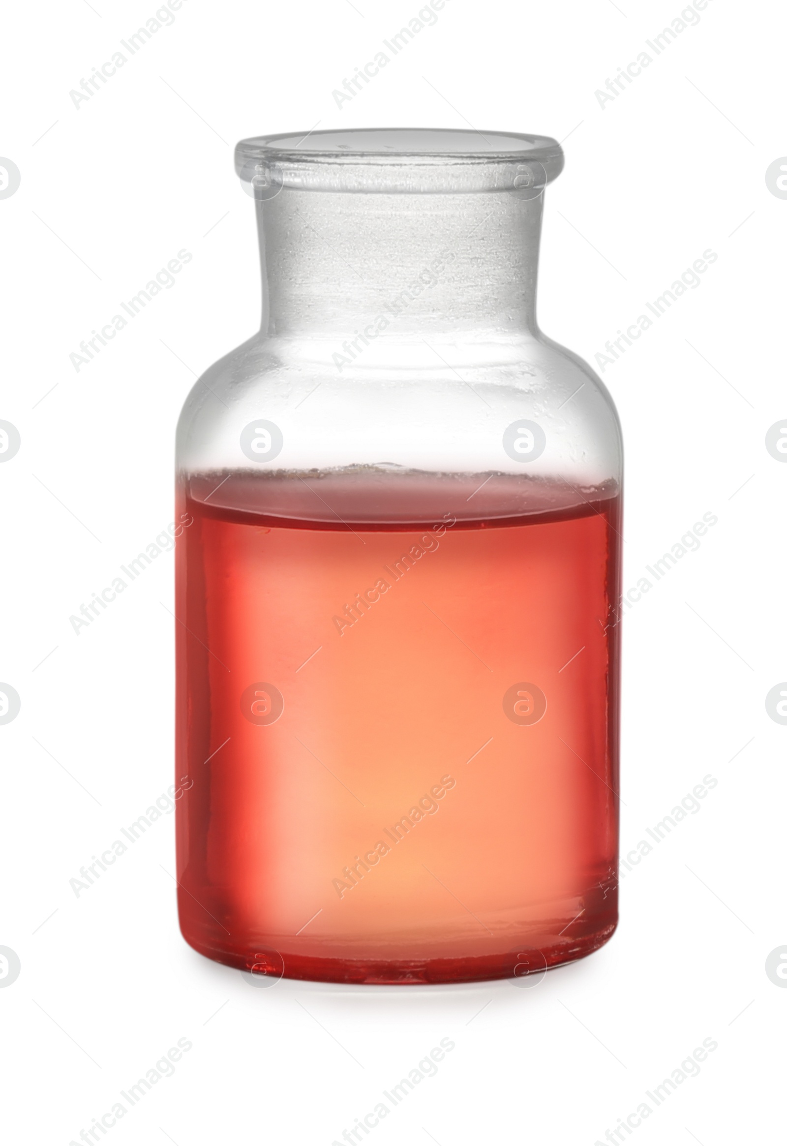 Photo of Apothecary bottle with red liquid isolated on white