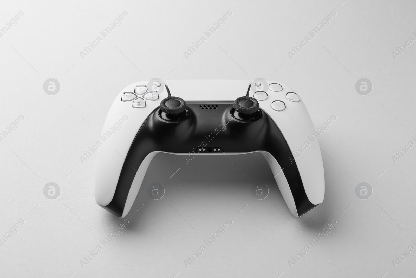 Photo of Wireless game controller on light grey background