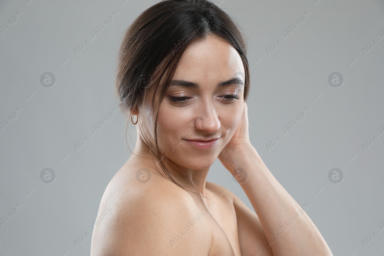 Photo of Portrait of beautiful woman on grey background