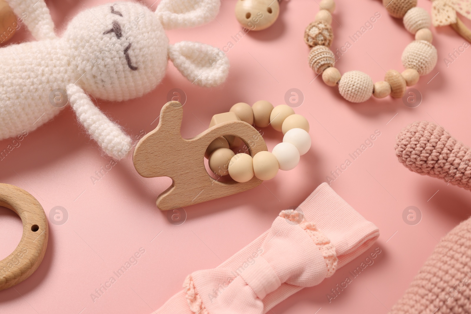 Photo of Different baby accessories on pink background, closeup