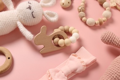 Photo of Different baby accessories on pink background, closeup