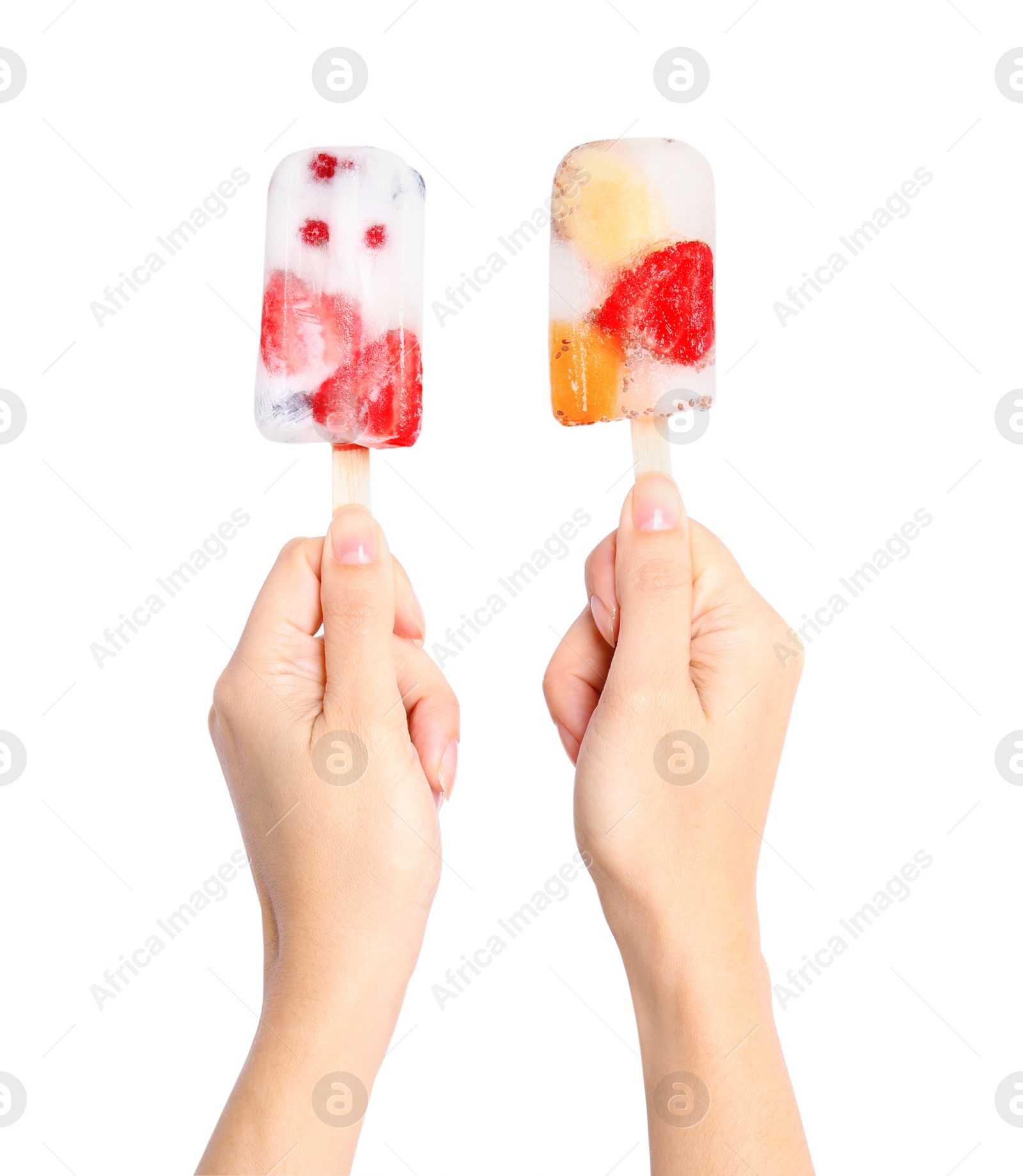 Photo of Woman holding berry popsicles on white background, closeup