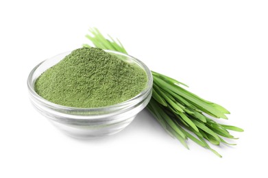 Photo of Wheat grass powder in glass bowl and fresh sprouts isolated on white
