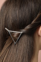 Photo of Young woman with beautiful hair clip, closeup