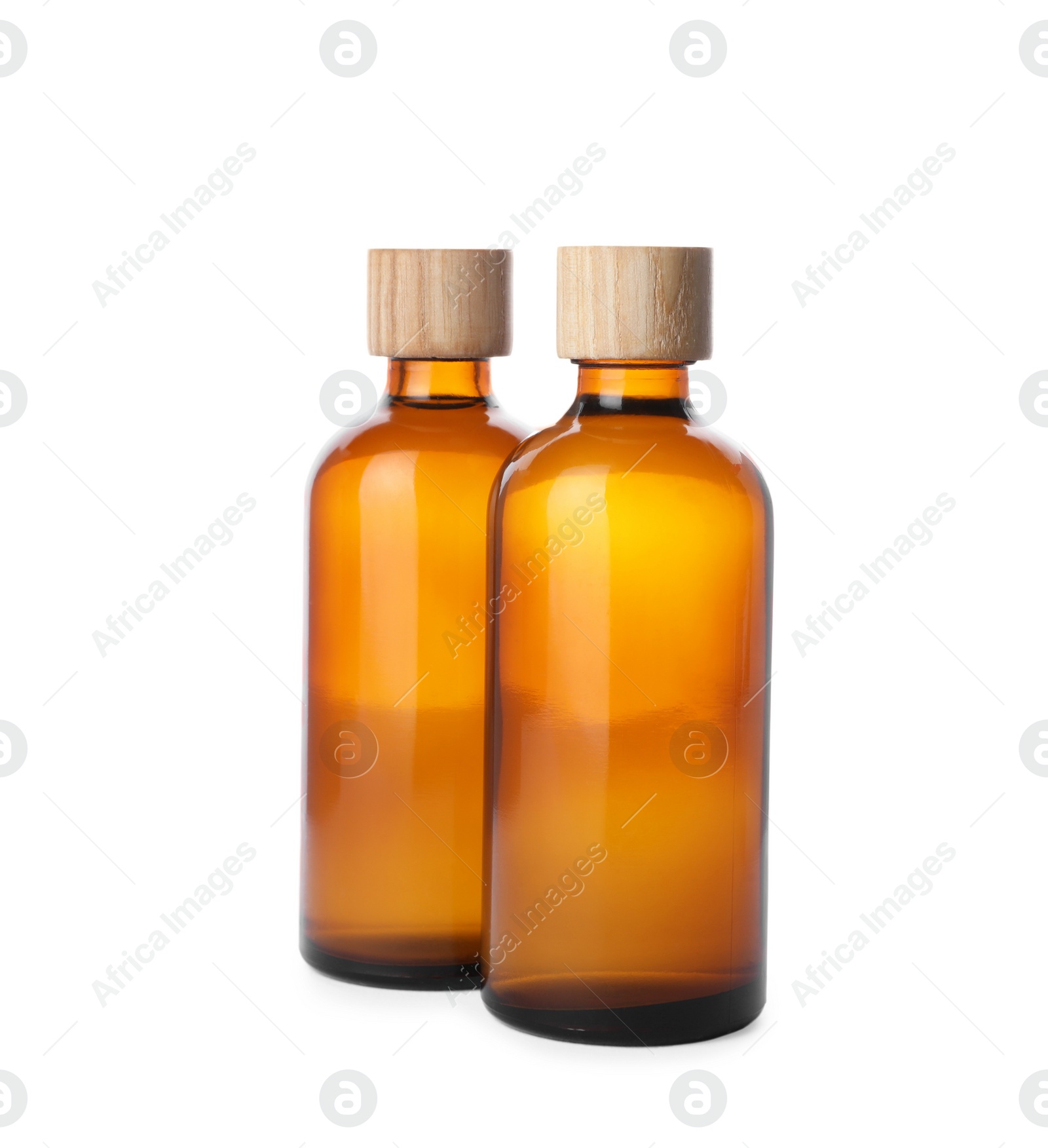 Photo of Bottles of essential oil on white background