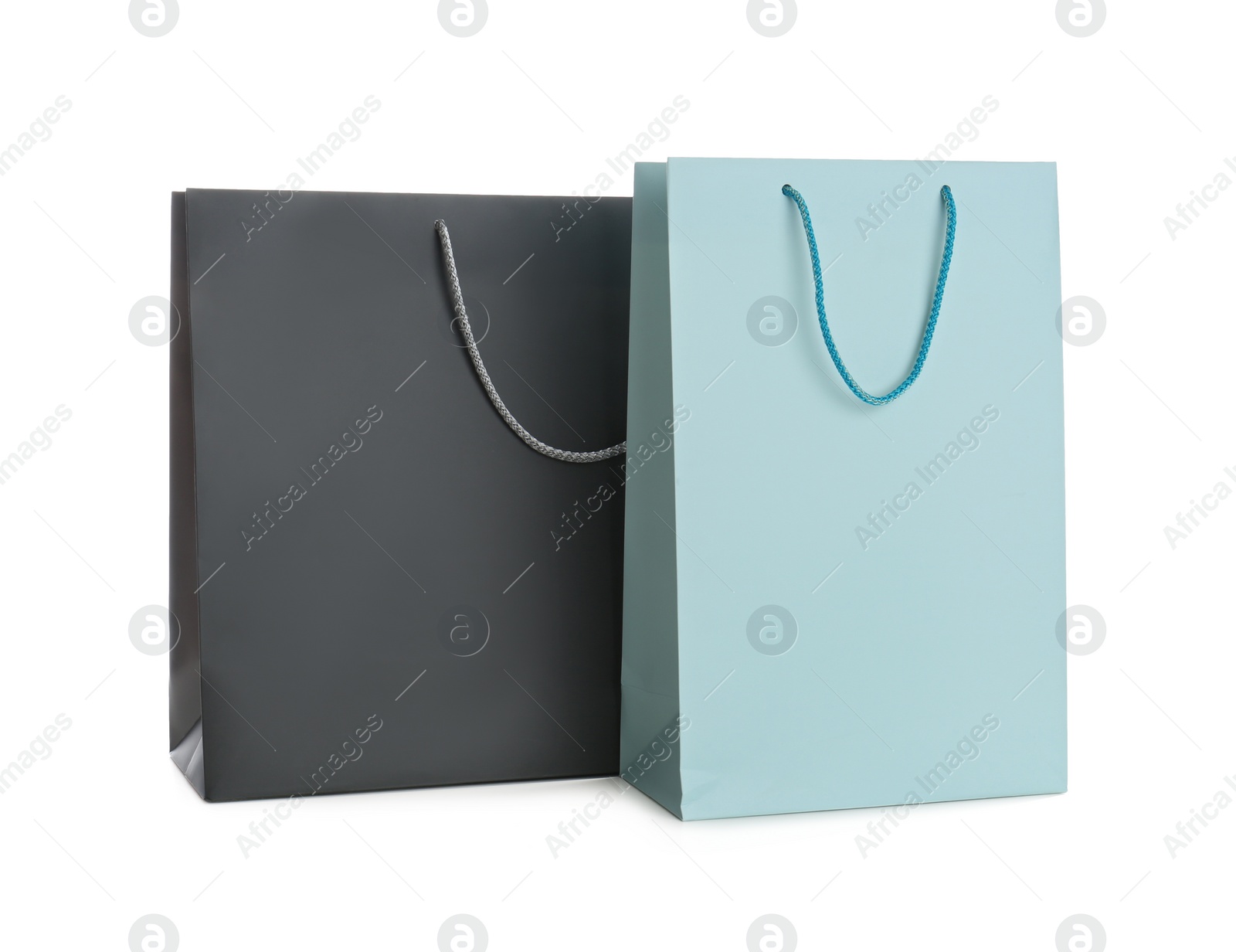 Photo of Different paper shopping bags isolated on white