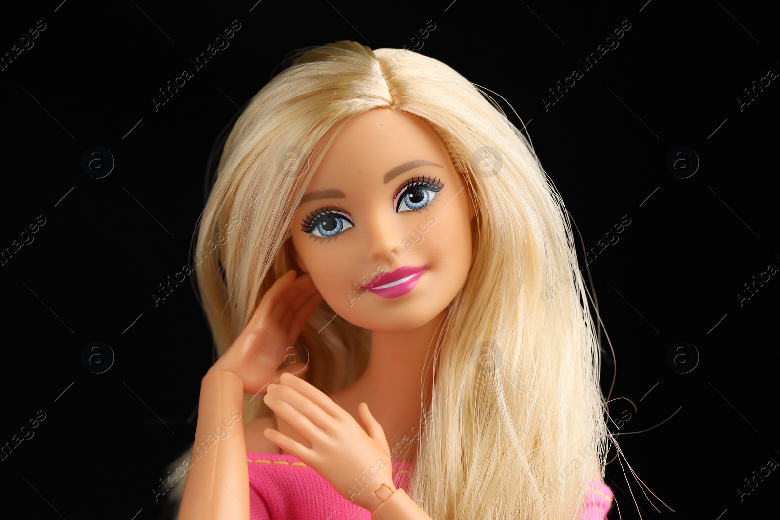 Photo of Mykolaiv, Ukraine - September 1, 2023: Beautiful Barbie doll on black background