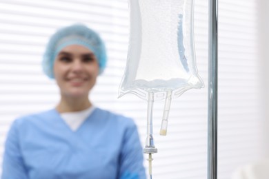 Photo of Setting up IV drip. Nurse in hospital, selective focus