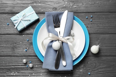 Photo of Beautiful Christmas table setting on grey wooden background, flat lay