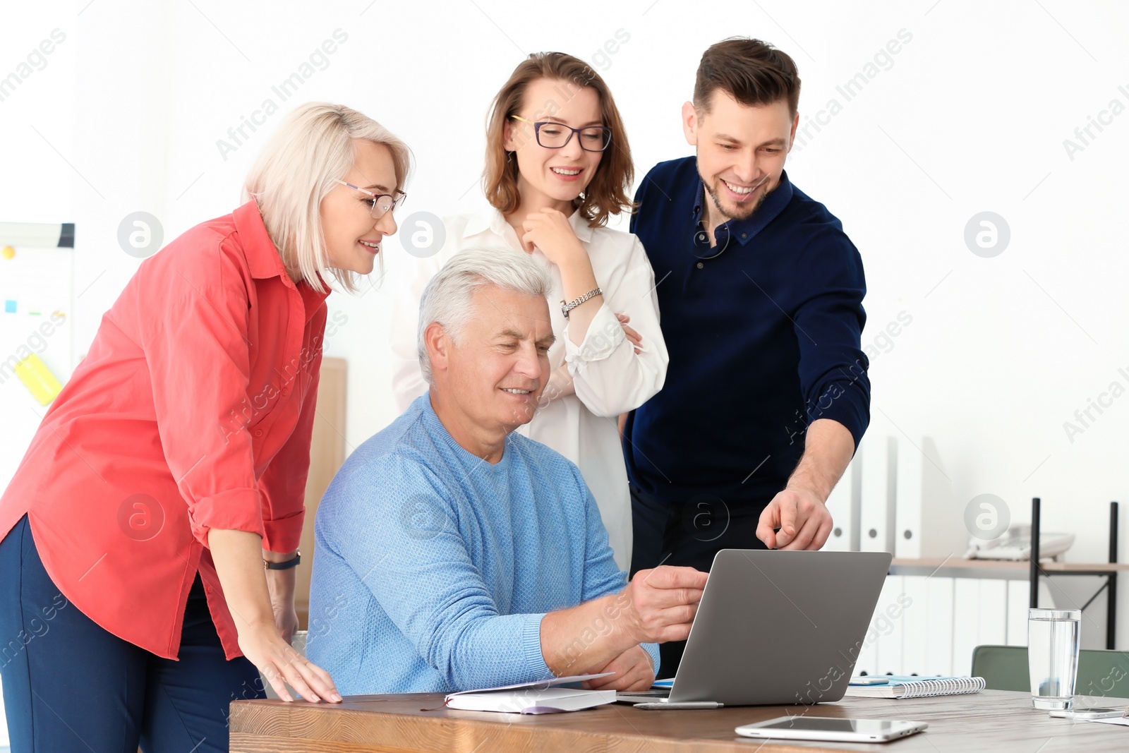 Photo of Group of people discussing ideas at table in office. Consulting service concept