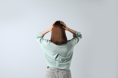 Photo of Girl wearing blouse on white background, back view