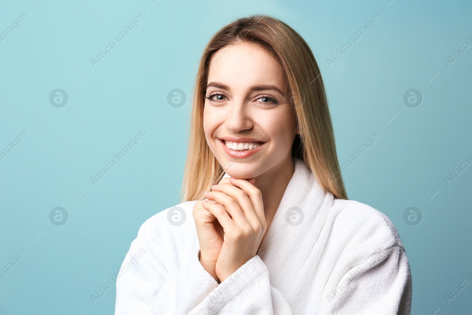 Photo of Beautiful young woman with silky skin on color background