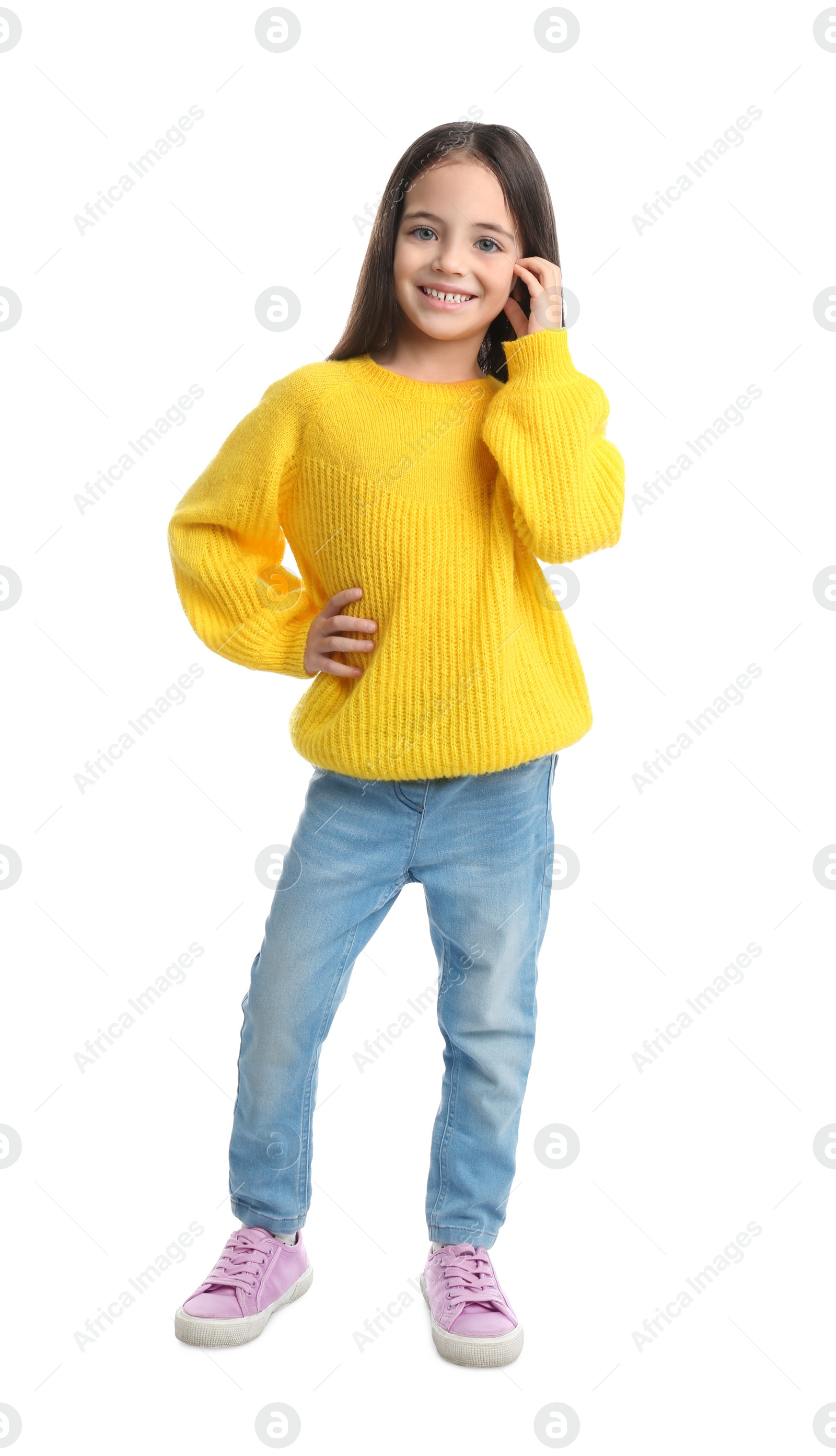 Photo of Cute little girl posing on white background