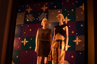 Paris, France - December 10, 2022: Mannequins with women's clothes in Louis Vuitton store display